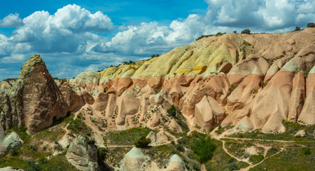 Martian landscape in Cappadocia, unique relief of mountains painted in yellow and pink colorsの写真素材