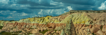 Martian landscape in Cappadocia, unique relief of mountains painted in yellow and pink colorsの写真素材