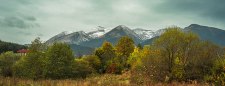 Bansko, Bulgaria, autumn landscape with colorful trees and peaks of the Pirin mountainsの写真素材