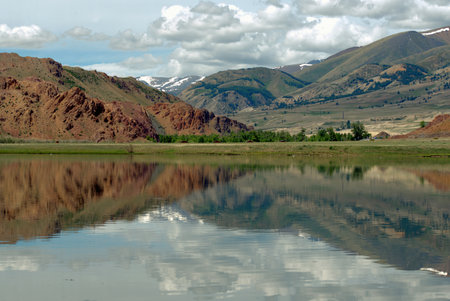 Lake with reflecting mountains, Altai Mountainsの写真素材