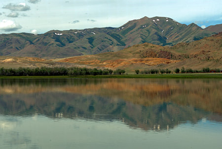 Lake with reflecting mountains, Altai Mountainsの写真素材