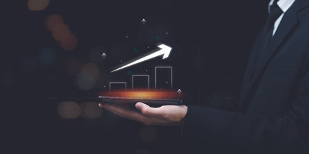 Businessman showing business growth and success graph ,concept of progress in development , financial efficiency and investment ,business strategy for goals ,future industry growth opportunitiesの写真素材