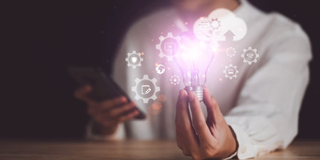 Businessman showing creative ideas in his hands ,creative thinking ,ideas and innovation ,Connecting creativity with modern technology ,Finding new solutions to solve business problemsの写真素材