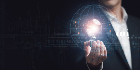 businessman holding light bulb Show business growth and international network connections ,modern cyberspace network technology concept ,to communicate and connect information through global societyの写真素材