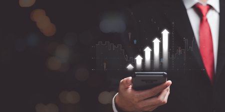 Businessman showing business growth and success graph ,increase in business profits ,Revenue and earnings analysis ,growth of the financial graph ,Developing marketing efficiency strategiesの写真素材