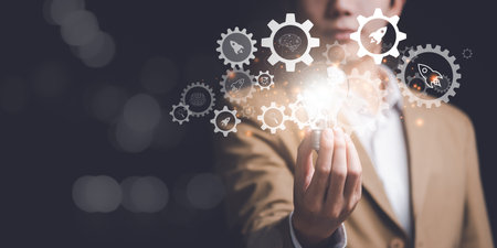 Businessman showing creative ideas in his hands ,creative thinking ,ideas and innovation ,Connecting creativity with modern technology ,Finding new solutions to solve business problemsの写真素材