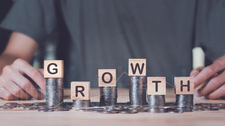 Businessman showing business growth and success graph ,concept of progress in development, financial efficiency and investment with business strategy for goals and opportunities in the industry futureの写真素材