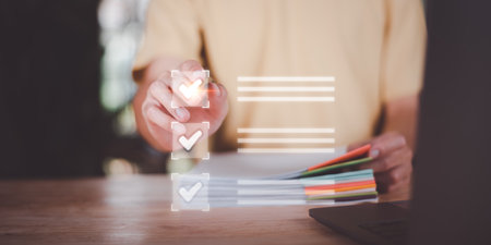 operator makes mark on the survey topic ,Auditing and evaluating the quality and efficiency  ,Checklist with checkmarks and checkboxes ,answering questionnaires ,Online Assessment ,quality inspectionの写真素材