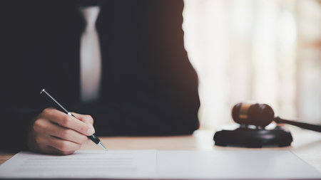 Businessman reviewing and managing documents and business agreements ,Signing a form ,signing a business contract approval ,contract documents confirmation or warranty certificate ,Business paperworkの写真素材