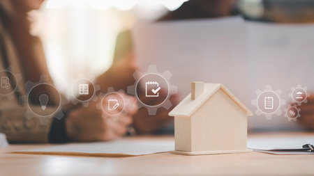 Real estate agents calculate interest rates for clients ,Investment loan approval concepts to build residential homes , real estate business , appraisal of property value ,home loan contractの写真素材