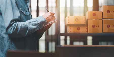 small business entrepreneur ,Check sales and check business growth reports ,order management in online stores ,shopping on the internet ,Selling online on Internet ,SME ,shipping boxes ,e-commerceの写真素材