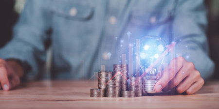 Businessman showing financial and investment concept with light bulb ,profit growth management ,high return investment ,bank interest management ,risk management ,financial planning and investmentの写真素材