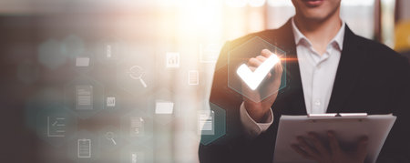 Businessman checking steps through online document with list of checkboxes ,regulation ,Concepts of practices and policies , procedure company articles of association Terms and Conditionsの写真素材