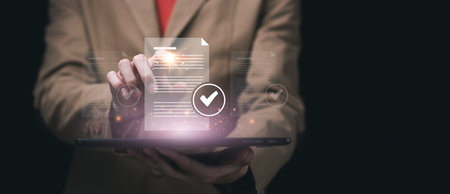 Businessman checking steps through document with a list of checkboxes ,regulation ,Concepts of practices and policies ,procedure company articles of association Terms and Conditions ,governanceの写真素材