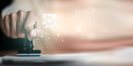 Businessman validates and manages business documents and agreements ,stamping in contract ,contract documents confirmation or warranty certificate ,joint venture agreement ,legal contractの写真素材