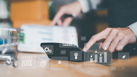 small entrepreneurs calculating figures in company financial documents with a calculator,analysis of...