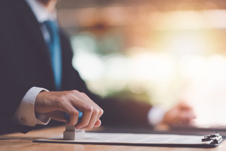Businessman validates and manages business documents and agreements,signing a business contract...