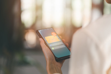 The smartphone and the bell icon show notifications of new messages,internet application notification concept,Cyberspace Communications, Connected Inboxes, Chats, Messages, and Appsの写真素材