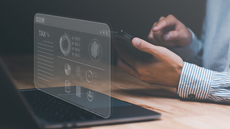 Businessman planning annual tax deduction, tax rate calculation, and business financial budget, effective tax deduction planning ideas for individuals and companies, state taxes. Data analysisの写真素材