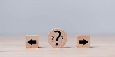 wooden blocks placed on the table , decision concept to find alternatives to success or business opportunities, different solutions, strategies fork ahead that must be decidedの写真素材