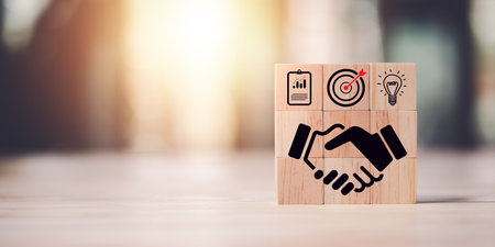 wooden blocks and business icons,business agreement concept,development progress Financial efficiency and investment with business strategies for the future goals and opportunities of the industry.の写真素材