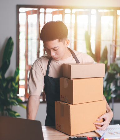Startup or small business entrepreneur, check details and prepare to deliver the product box, order management in online stores, shopping on the internet,Selling online on the Internet,SME,e-commerceの写真素材