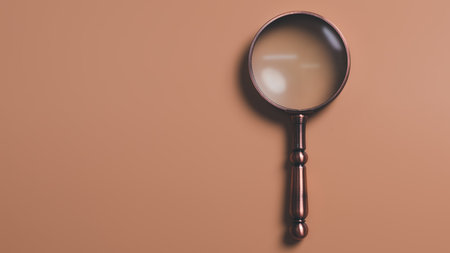 A magnifying glass is placed on an orange background, information search concept, conducting research, acquiring knowledge from study and research, Search Engine Optimization.の写真素材