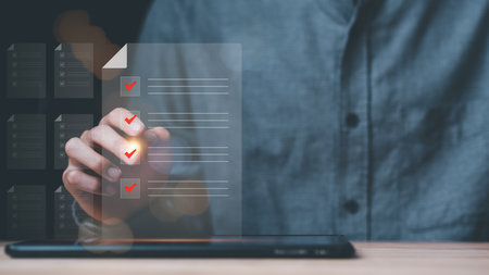 businessman putting a checkmark on survey online topic,virtual form check sheet,checkbox to conduct opinion and quality surveys or satisfaction ,contract documents confirmation or warranty certificateの写真素材