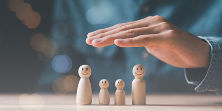 Male hand Represents the protection and protection of family safety, Insurance management planning...