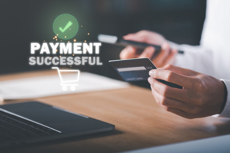 Young businessman using credit card to make financial transactions via smartphone, payment concept with wireless communication technology, focus on consumer safety and cashlessness,successful paymentの写真素材