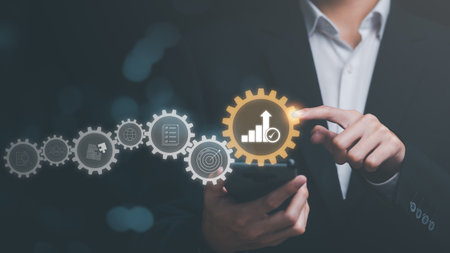 Businessman showing business growth and success graph ,concept of progress in development, financial efficiency and investment with business strategy for goals and opportunities in the industry futureの写真素材