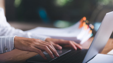 business accounting documents,auditor,management and auditing of office documents,Reports for Tax Time Analysis,office worker working with documents at home office desk,work at homeの写真素材