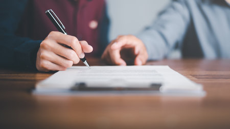 Businessman pointing and signing a business agreement,concept progress in development, financial...