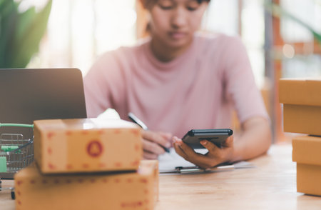 Startup or small business entrepreneur,Make a note of the delivery address from the customer,order management in online stores, shopping on the internet,Selling online on the Internet,SME,e-commerceの写真素材