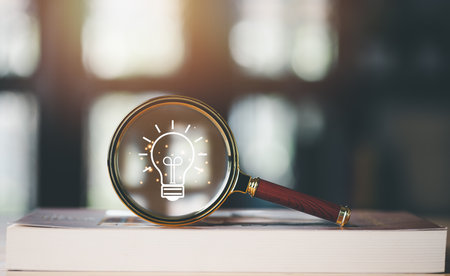 for Concept new idea, concept with innovation and inspiration, innovative technology in science concept and modern business development,creative idea,a magnifying glass is placed on the bookの写真素材