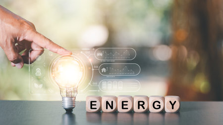 protecting the environment alternative energy Sustainable renewable energy sources Green energy innovation and environmentally friendly energy technology,hand pointing at light bulbの写真素材