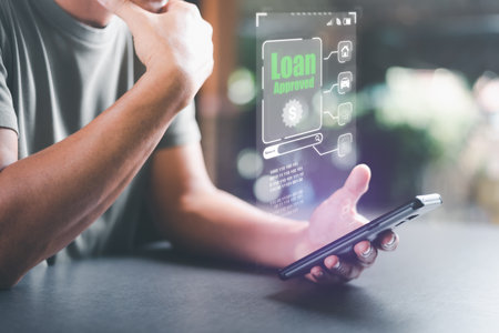 man looking at smartphone,concept of a loan for housing,Approval of credit for the purchase of real estate,business and finance concept,home loan refinancing,Residential sale and mortgage planningの写真素材