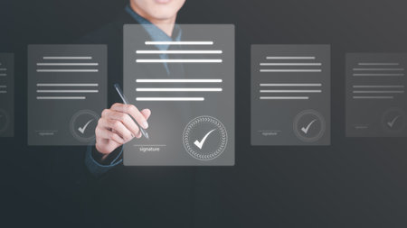 Businessman reviewing and managing documents and business agreements online, signing a business contract approval of contract documents confirmation or warranty certificate,employment ideaの写真素材