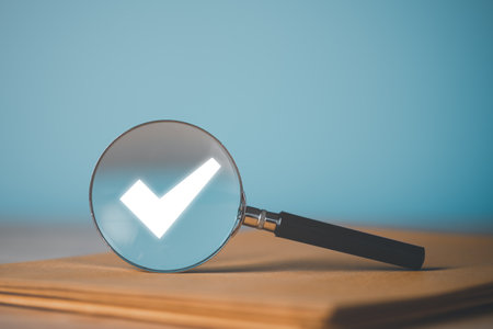 magnifying glass and check mark icon,show check the authenticity of the document,concept of rules of conduct rules and policies company regulations Terms and Conditionsの写真素材