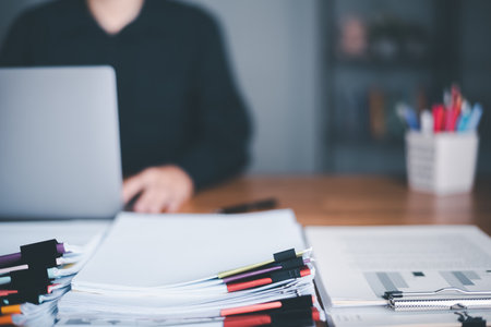 businessman and pile of documents, document management system, manage financial and marketing documents, accounting, annual budget, company growth update, business accounting documents,の写真素材