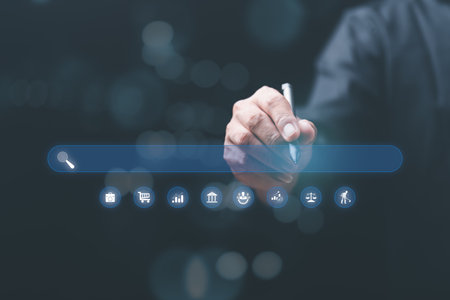 A young man searches for information that interests him through online websites, keyword search concept to find information from online websites, website link search, SEO, Search Engine Optimization.の写真素材