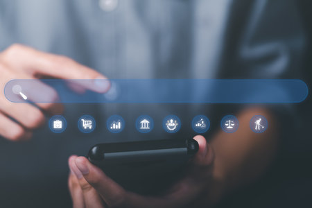 A young man searches for information that interests him through online websites, keyword search...