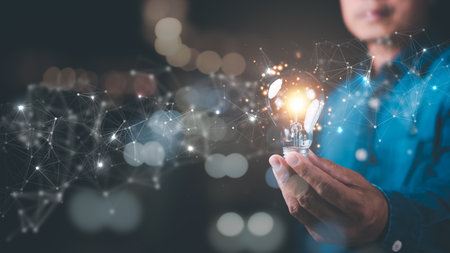 man holding a light bulb,modern cyberspace network technology concept,to communicate and connect information through global society,innovative and scientific idea,working through high speed internetの写真素材