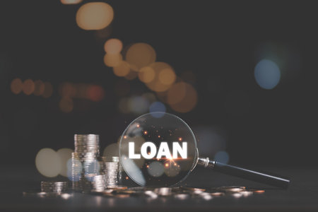 Stacks of coins and a magnifying glass on the table,investment loan concepts to build a residential...