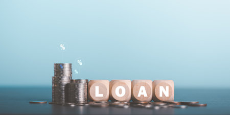 Stacks of coins and wooden blocks on table,investment loan concepts to build a residential home,real estate business,investment savings,mortgage and bank loans,future retirement planningの写真素材