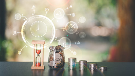 The hourglass, the coin, and the glass jar, all on the table,time management concepts for saving...