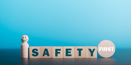 professional work safety concept,Policies, Regulations and Safety First Rules, Industry Standards,prevention and health care,workplace safety,wooden blocks on the tableの写真素材