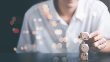 Male consumer chooses wooden blocks showing evaluation and satisfaction rating, customer experience survey concept for services and products and customer engagement,service quality assessmentの写真素材