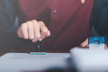Businessman validates and manages business documents and agreements, signing a business contract...
