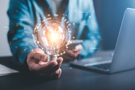 innovative technology in science and communication concepts,Technology creativity for future inventions and developments,Business for innovative solution concept,Businessman holding a light bulbの写真素材